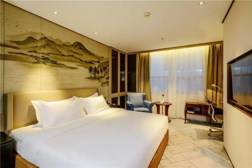 Bed in Dahe Jinjiang Hotel