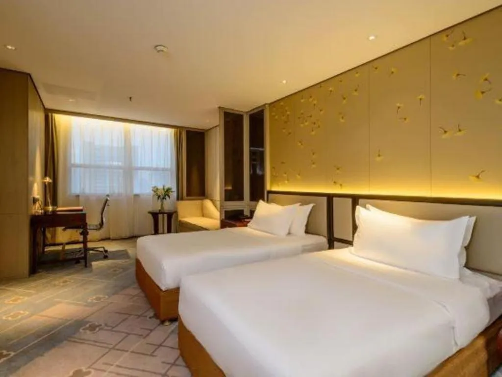 Bed in Dahe Jinjiang Hotel