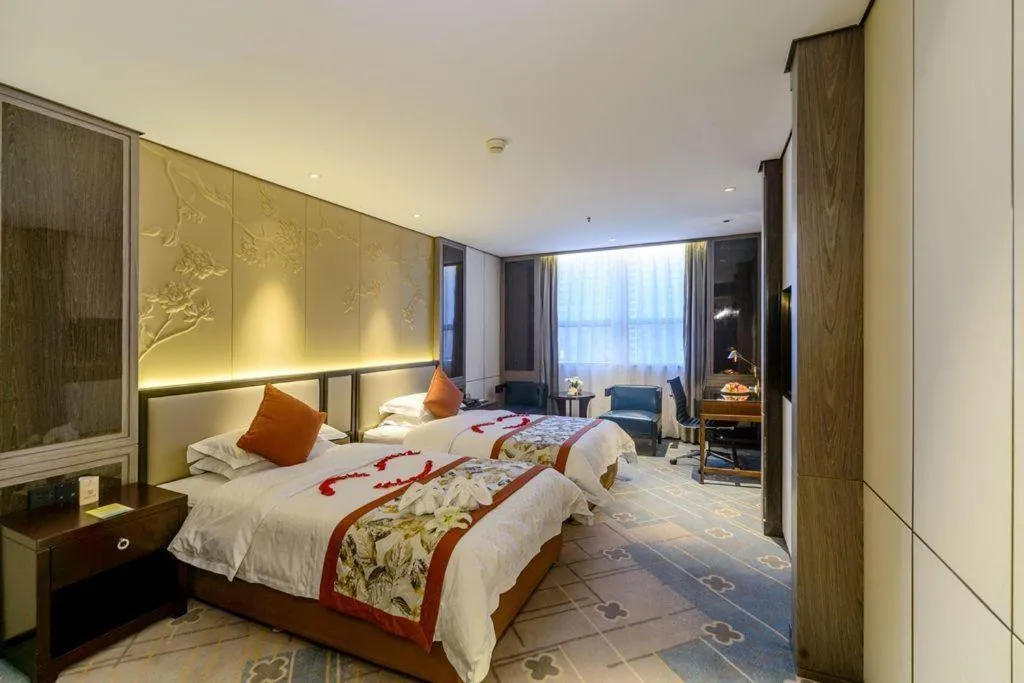 Bed in Dahe Jinjiang Hotel