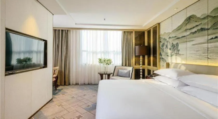 Bed in Dahe Jinjiang Hotel