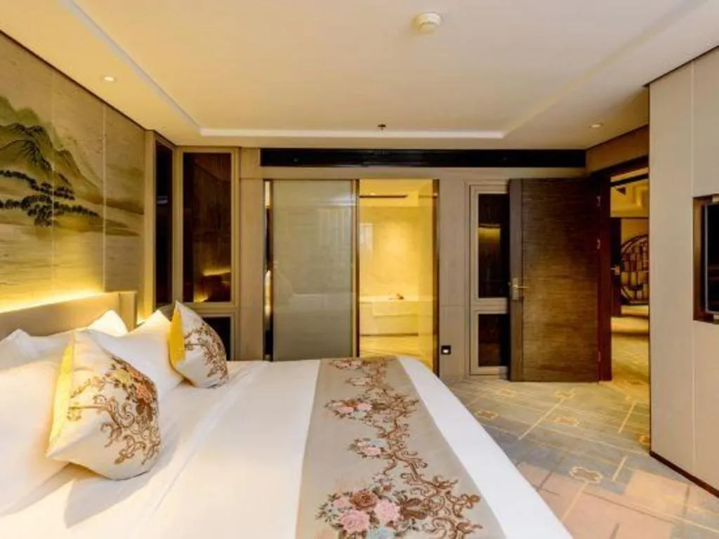 Bed in Dahe Jinjiang Hotel