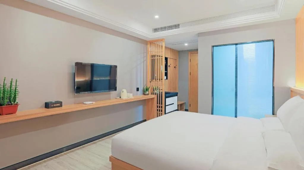 Bed in Shell Hotel Nanyang High-Speed Railway Station Jiangying Airport Huayaocheng