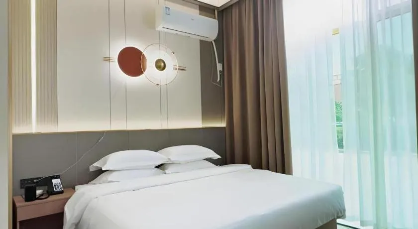 Bed in Shell Hotel Nanyang High-Speed Railway Station Jiangying Airport Huayaocheng
