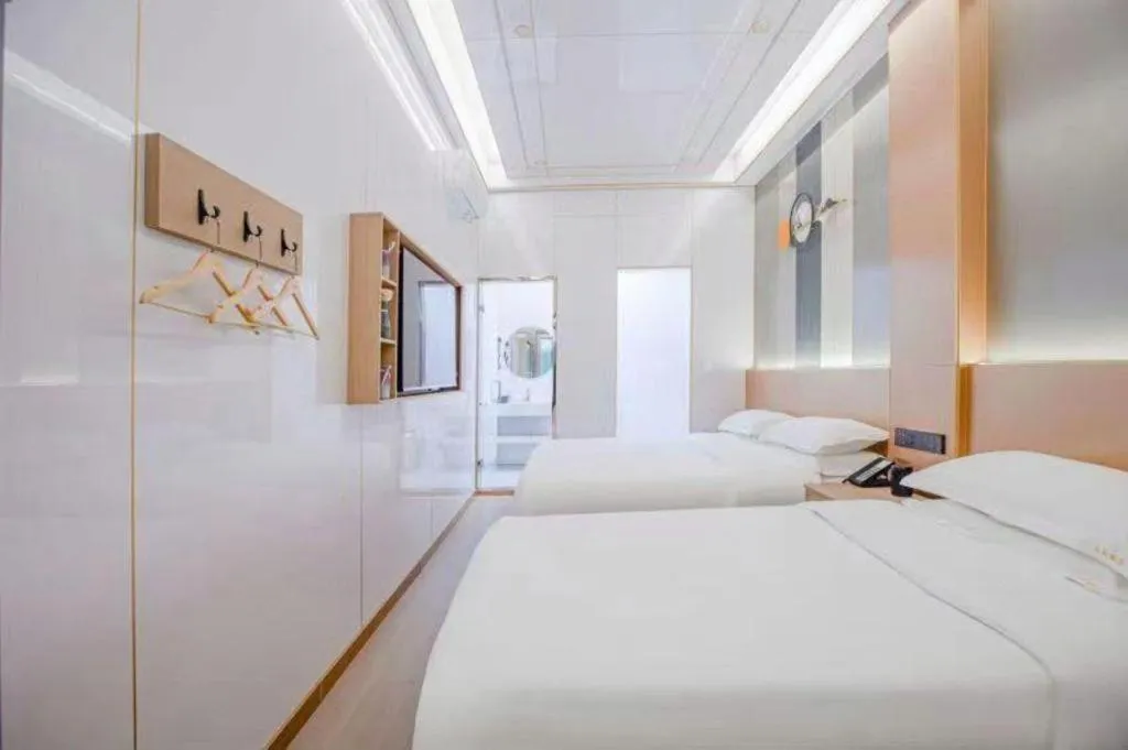 Bed in Shell Hotel Nanyang High-Speed Railway Station Jiangying Airport Huayaocheng