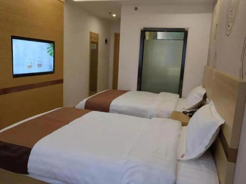 Bed in Shell Hotel Beijing Fangshan District Chengguan Metro Station