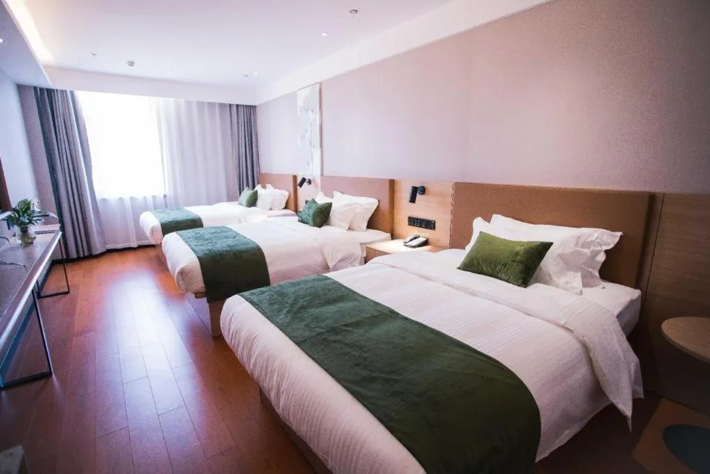 Bed in GreenTree Inn Tangshan Nanhu International Exhibition Center
