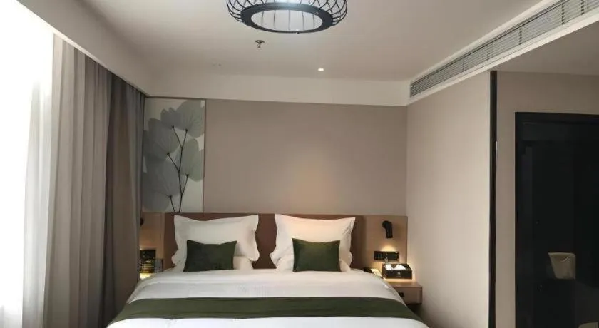 Bed in GreenTree Inn Tangshan Nanhu International Exhibition Center