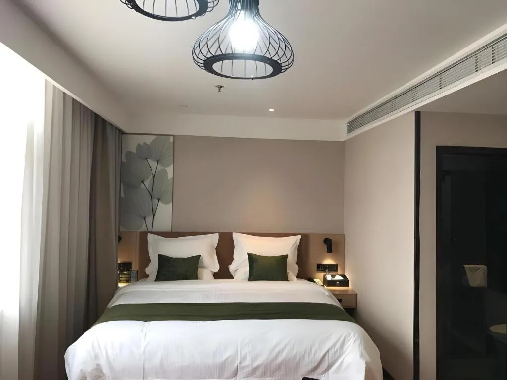 Bed in GreenTree Inn Tangshan Nanhu International Exhibition Center