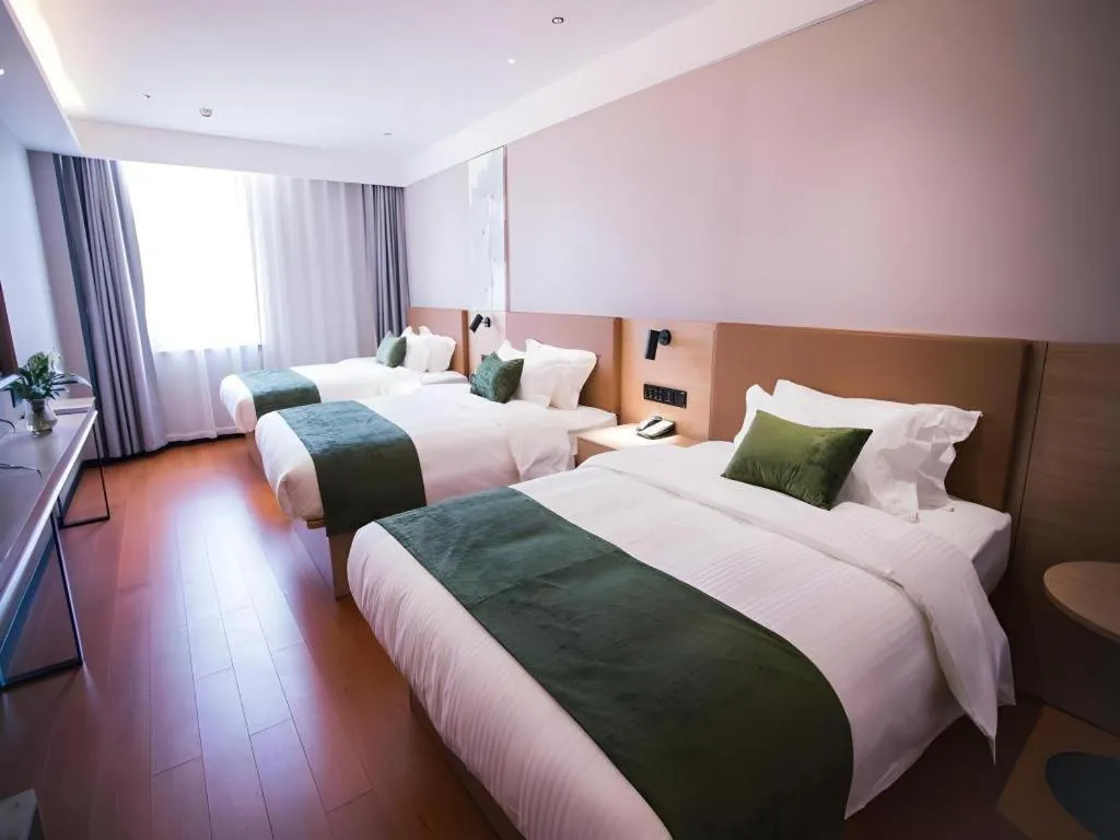 Bed in GreenTree Inn Tangshan Nanhu International Exhibition Center