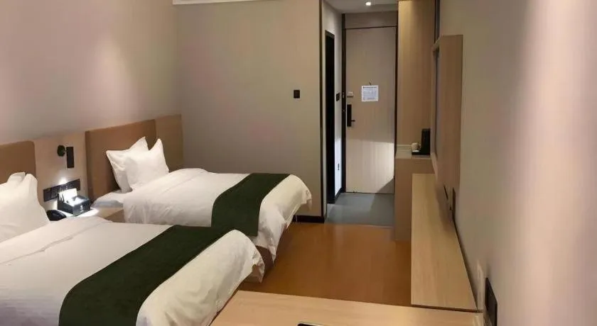 Bed in GreenTree Inn Tangshan Nanhu International Exhibition Center