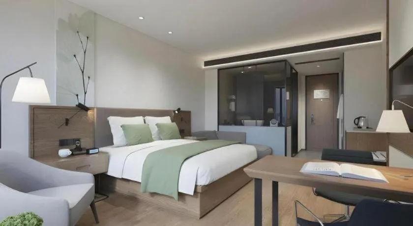 Bed in GreenTree Inn Tangshan Nanhu International Exhibition Center