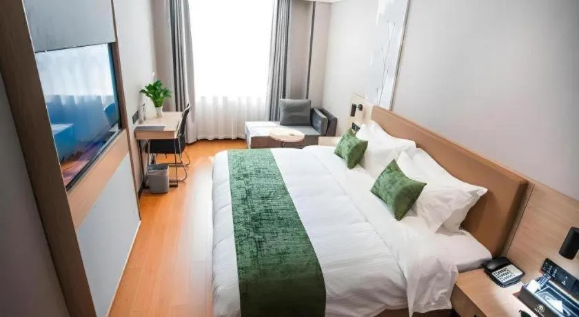 Bed in GreenTree Inn Tangshan Nanhu International Exhibition Center