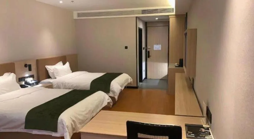 Bed in GreenTree Inn Tangshan Nanhu International Exhibition Center