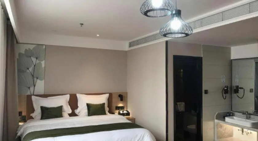 Bed in GreenTree Inn Tangshan Nanhu International Exhibition Center