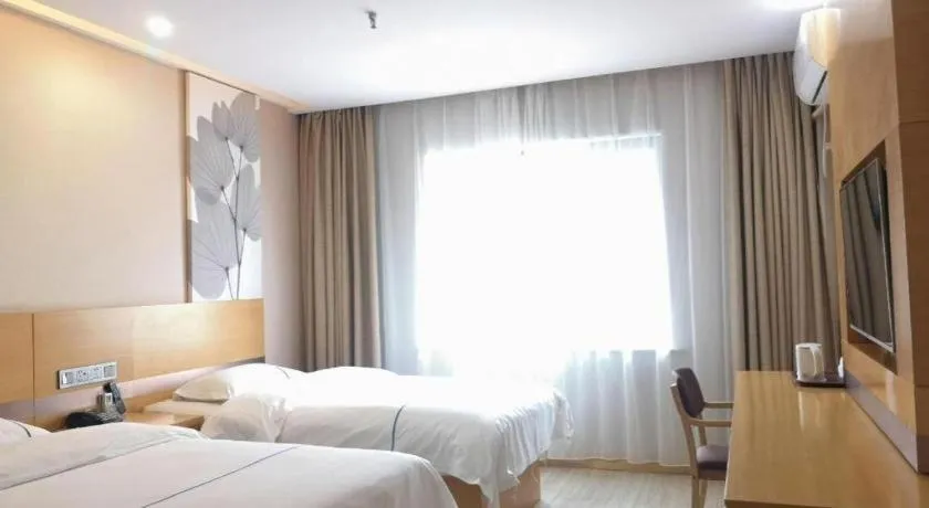 Bed in GreenTree Inn Express Shanghai Baoshan District Youyi Road Metro Station