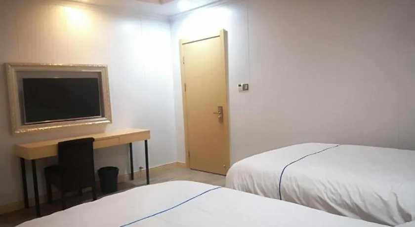 Bed in GreenTree Inn Express Shanghai Baoshan District Youyi Road Metro Station