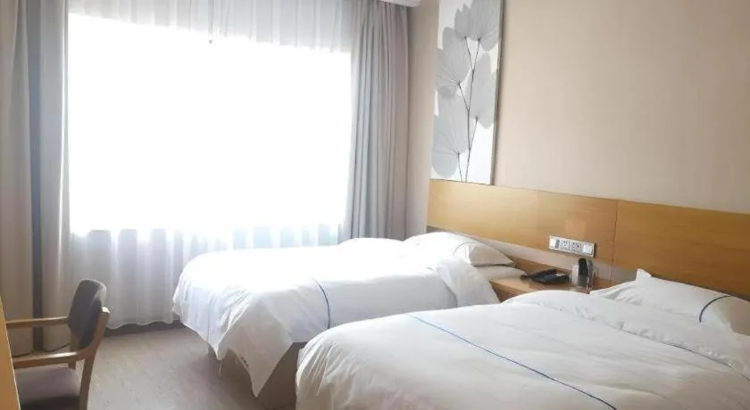 Bed in GreenTree Inn Express Shanghai Baoshan District Youyi Road Metro Station