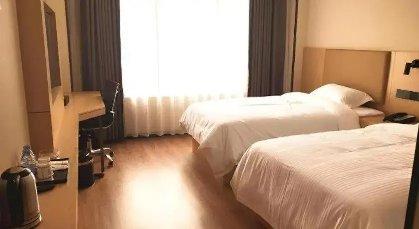 Bed in GreenTree Inn Express Yingtan Yujiang Railway Station Bed in GreenTree Inn Express Yingtan Yujiang Railway Station