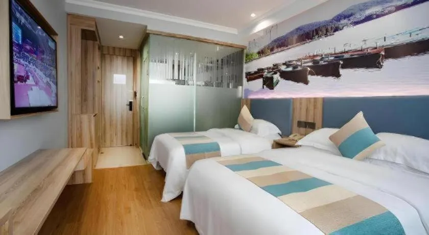 Bed in VX Hotel Hangzhou Banshan