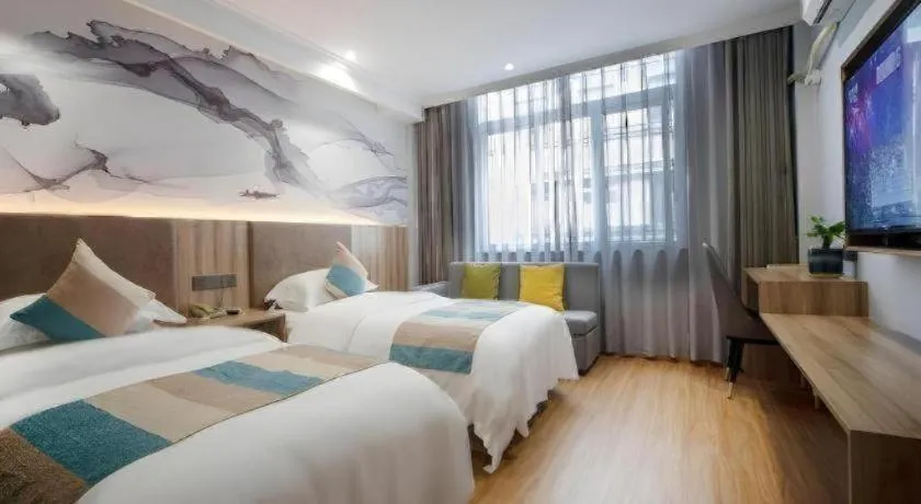 Bed in VX Hotel Hangzhou Banshan