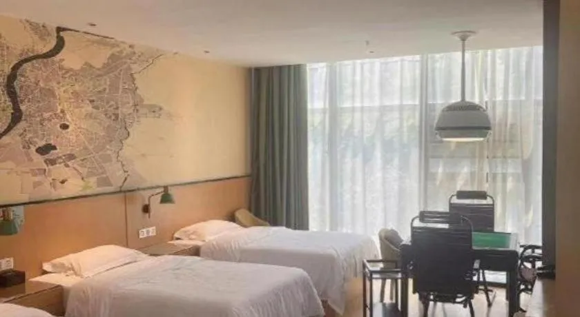 Bed in Vatica Hotel Hefei Yaohai Longgang Subway Station