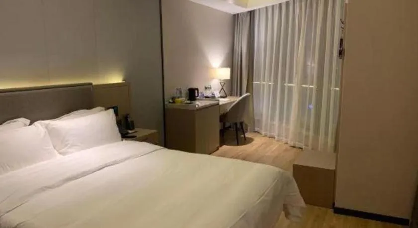 Bed in Gya Hotel Nantong Nanshang Lake Street Wanda Plaza