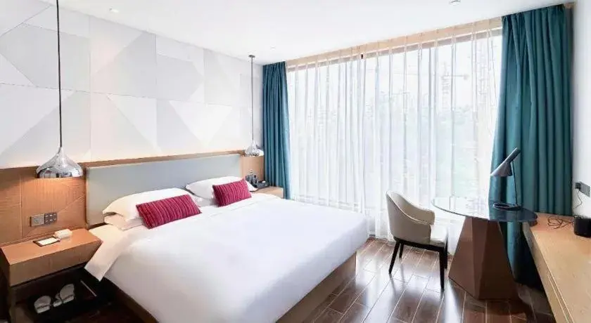 Bed in Borrman Hotel Guigang Pingnan Donghu Bed in Borrman Hotel Guigang Pingnan Donghu