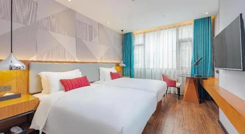 Bed in Borrman Hotel Guigang Pingnan Donghu Bed in Borrman Hotel Guigang Pingnan Donghu