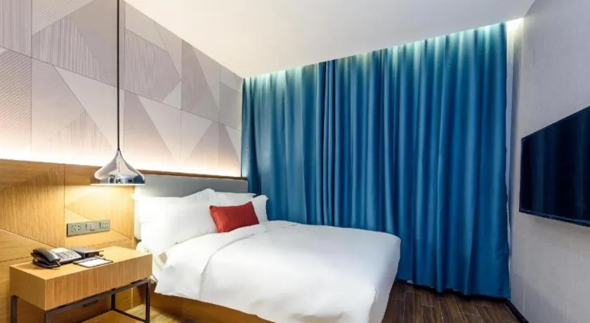 Bed in Borrman Hotel Guigang Pingnan Donghu