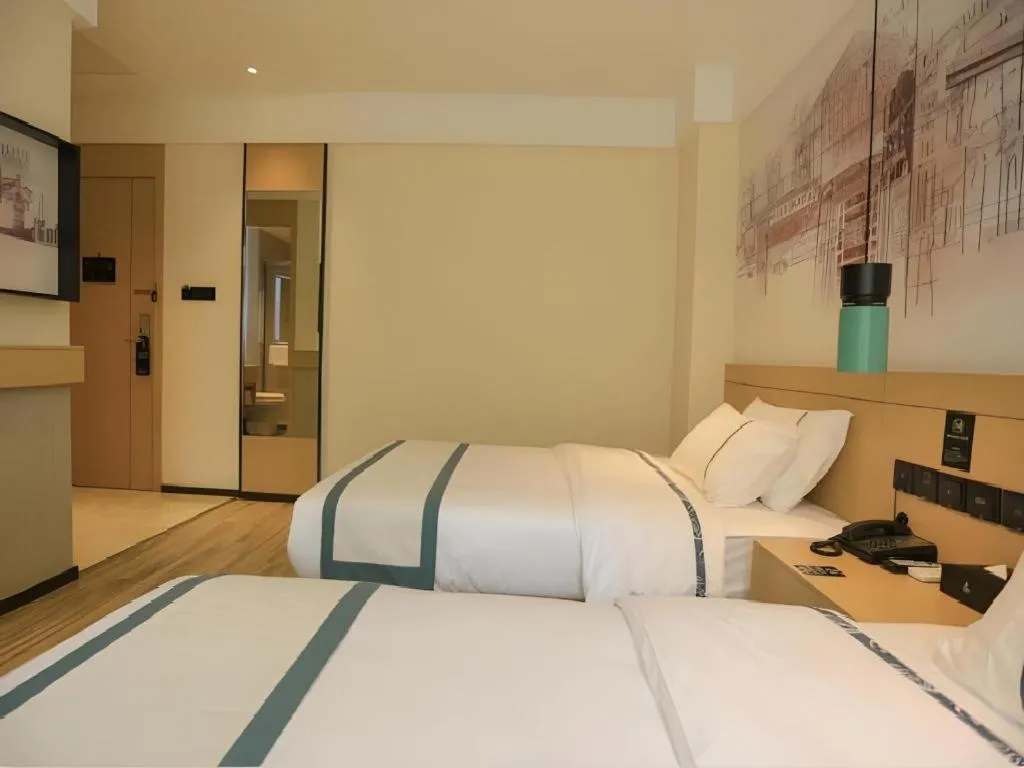 Bed in City Comfort Inn Nanchang Zhangshulin Shashagou Metro Station