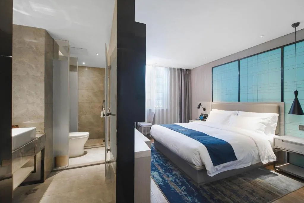 Bed in Echarm Hotel Changsha Wuyi Square Railway Metro Station