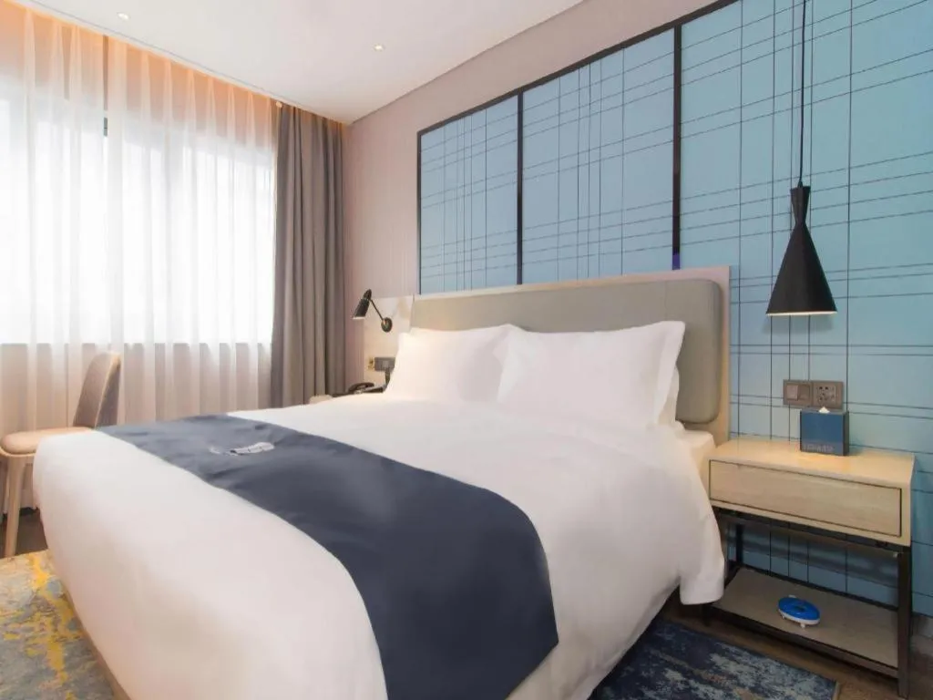 Bed in Echarm Hotel Changsha Wuyi Square Railway Metro Station