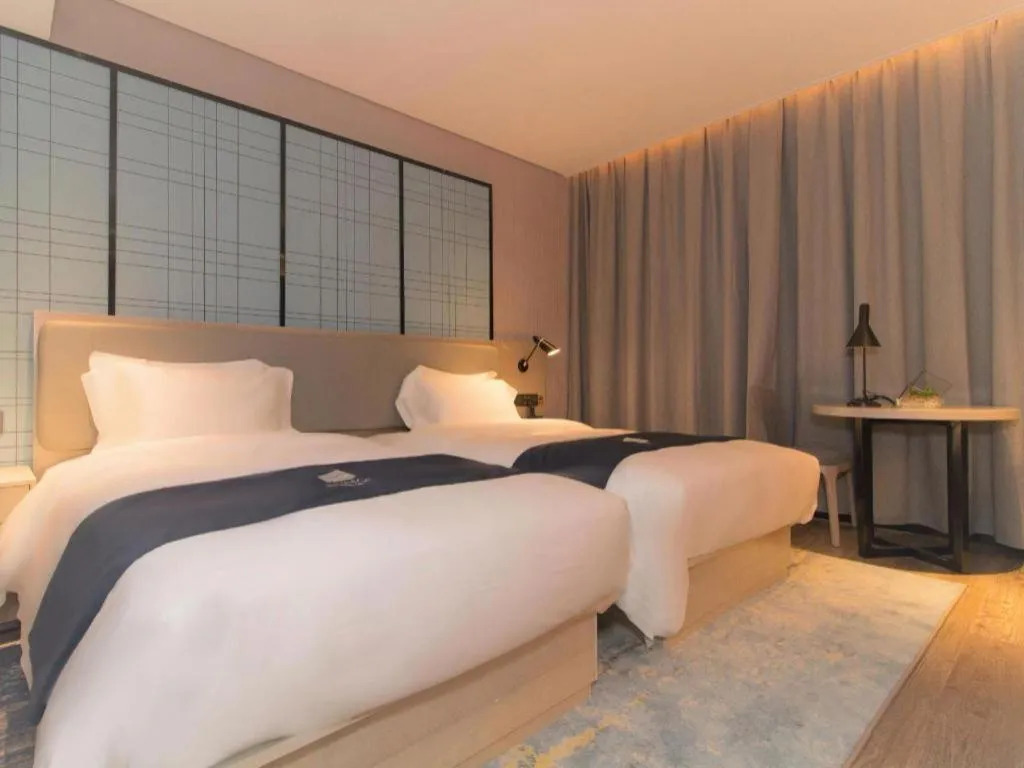 Bed in Echarm Hotel Changsha Wuyi Square Railway Metro Station