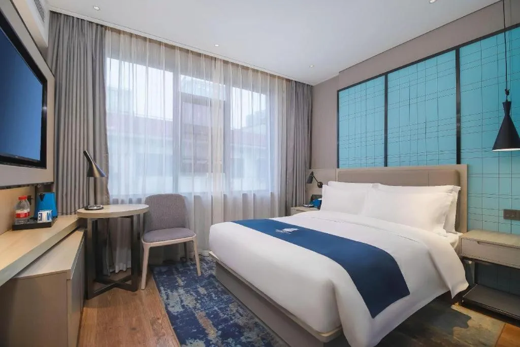 Bed in Echarm Hotel Changsha Wuyi Square Railway Metro Station