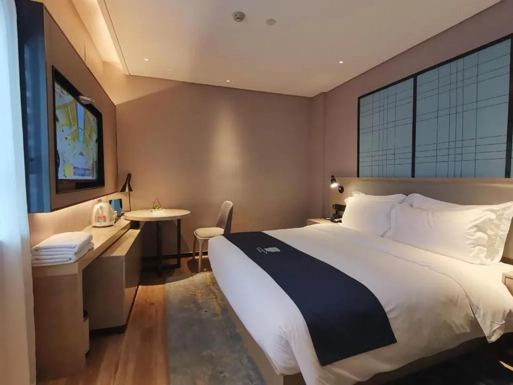 Bed in Echarm Hotel Changsha Wuyi Square Railway Metro Station