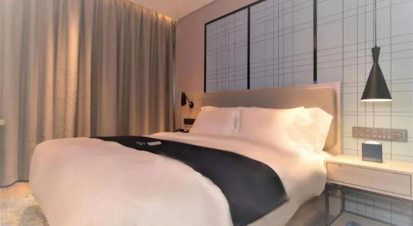 Bed in Echarm Hotel Changsha Wuyi Square Railway Metro Station