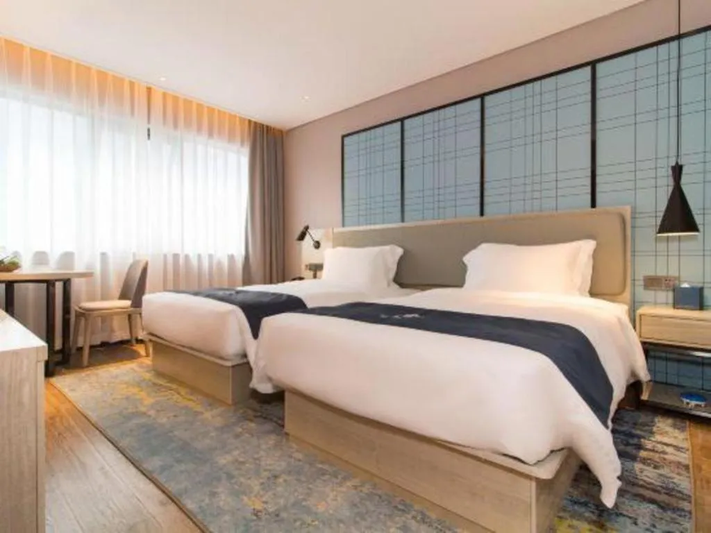 Bed in Echarm Hotel Changsha Wuyi Square Railway Metro Station