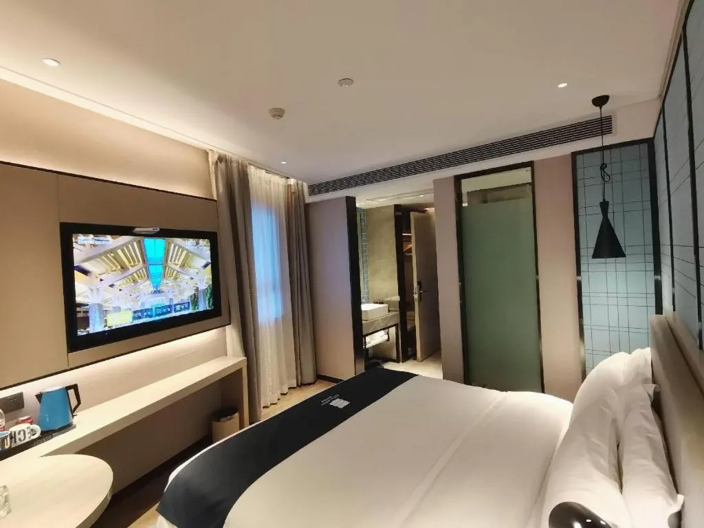 Bed in Echarm Hotel Changsha Wuyi Square Railway Metro Station