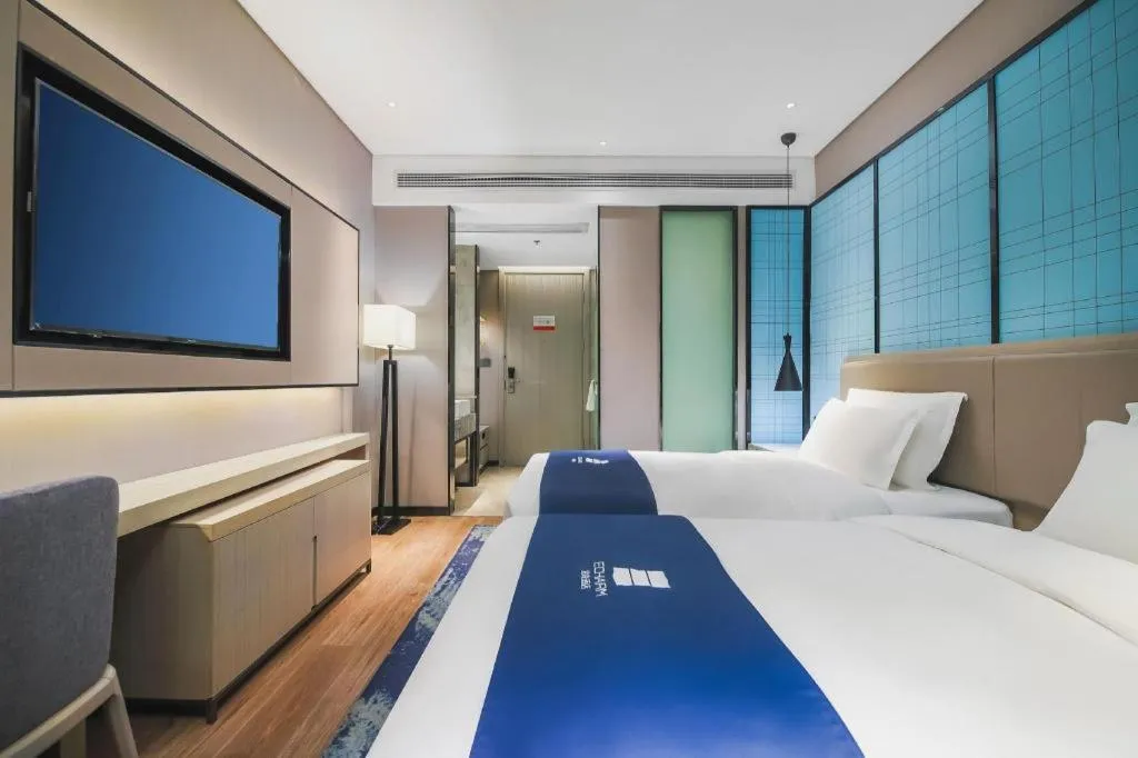 Bed in Echarm Hotel Changsha Wuyi Square Railway Metro Station
