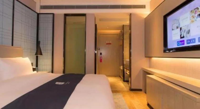 Bed in Echarm Hotel Changsha Wuyi Square Railway Metro Station