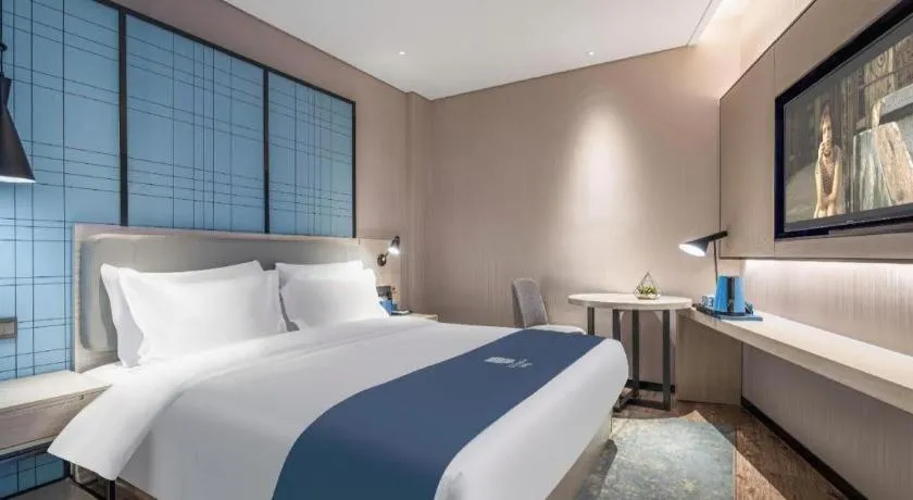 Bed in Echarm Hotel Changsha Wuyi Square Railway Metro Station