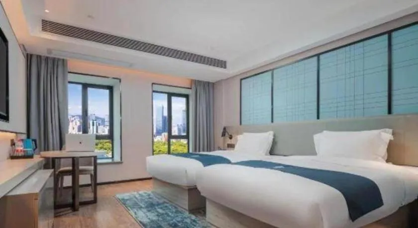 Bed in Echarm Hotel Changsha Wuyi Square Railway Metro Station