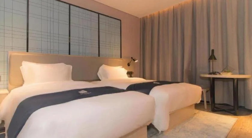 Bed in Echarm Hotel Changsha Wuyi Square Railway Metro Station