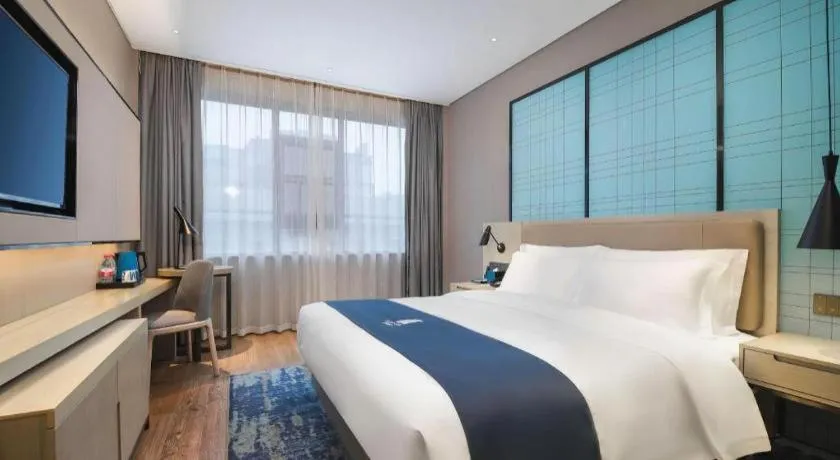 Bed in Echarm Hotel Changsha Wuyi Square Railway Metro Station