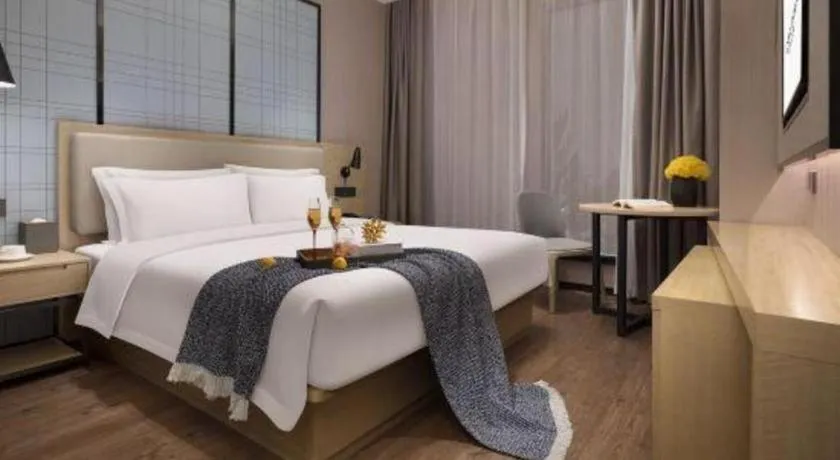 Bed in Echarm Hotel Changsha Wuyi Square Railway Metro Station