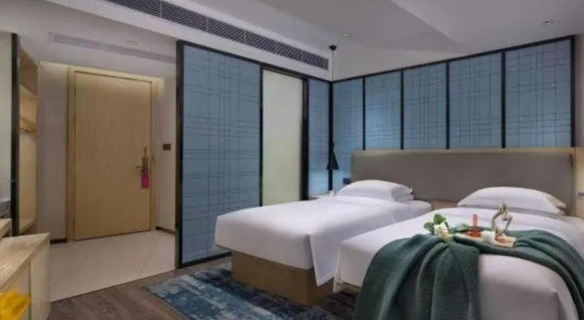 Bed in Echarm Hotel Changsha Wuyi Square Railway Metro Station