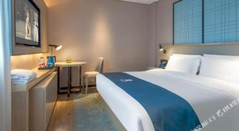 Bed in Echarm Hotel Changsha Wuyi Square Railway Metro Station