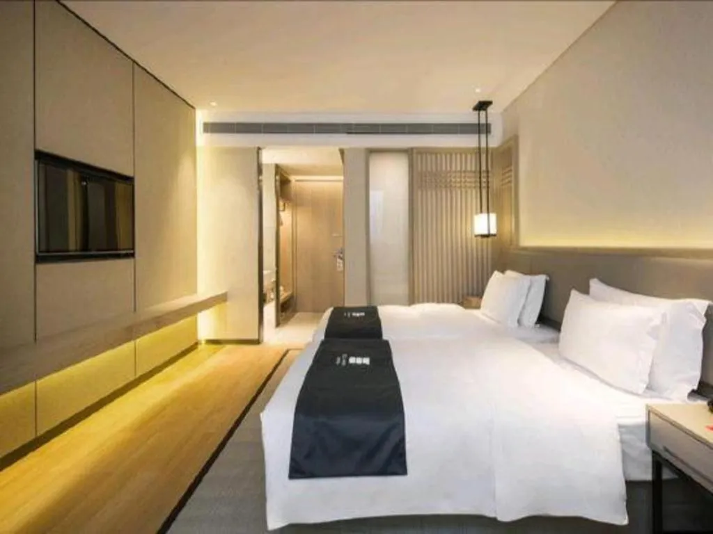 Bed in Echarm Hotel Changsha Wuyi Square Railway Metro Station
