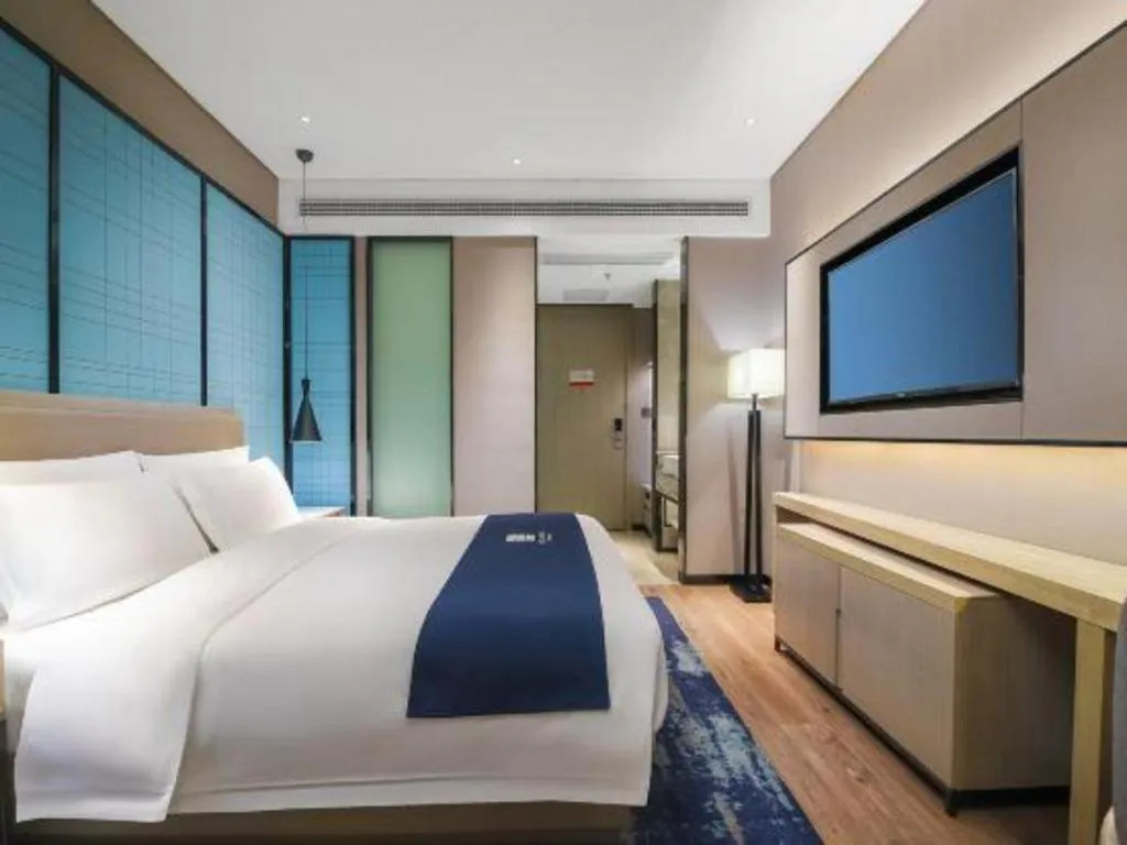 Bed in Echarm Hotel Changsha Wuyi Square Railway Metro Station