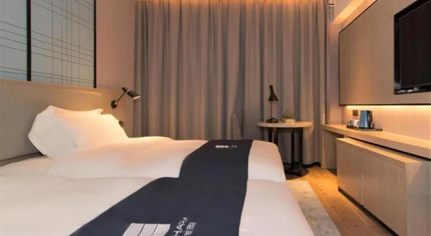 Bed in Echarm Hotel Changsha Wuyi Square Railway Metro Station